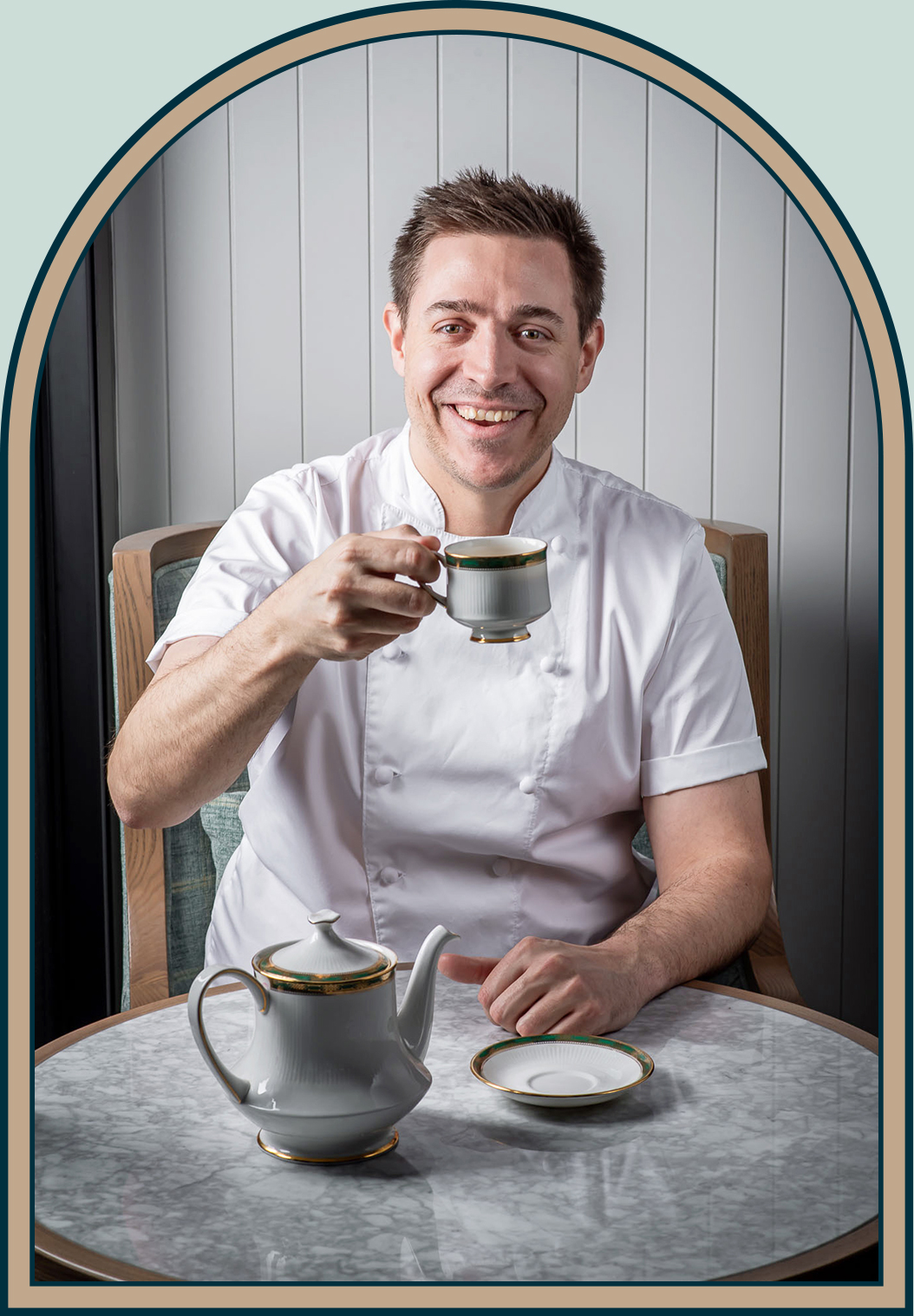 Portrait of District Executive Chef Ryan Lister holding a cup of tea
